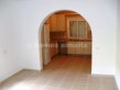 Lounge with arch to kitchen